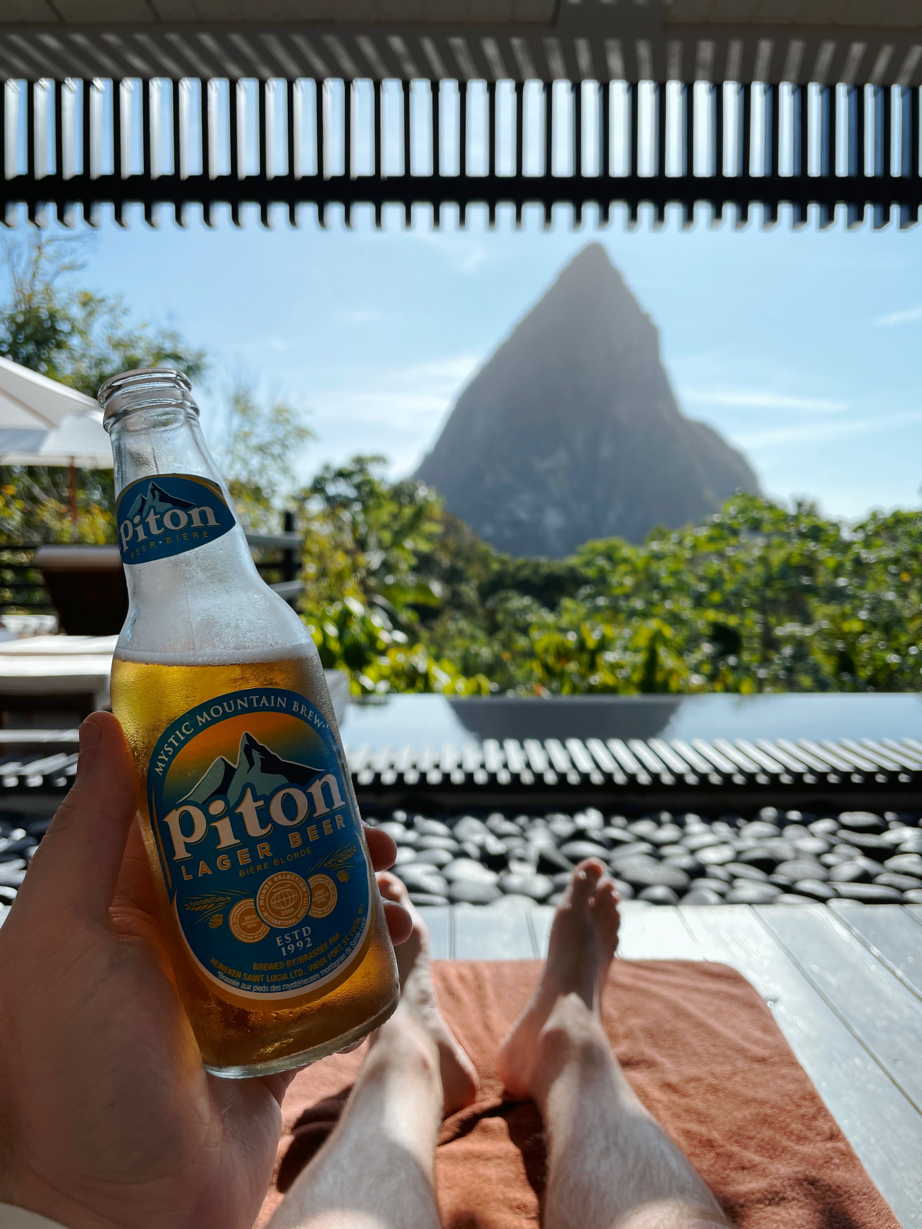 bottle of piton lager looking at st. lucia's gros piton